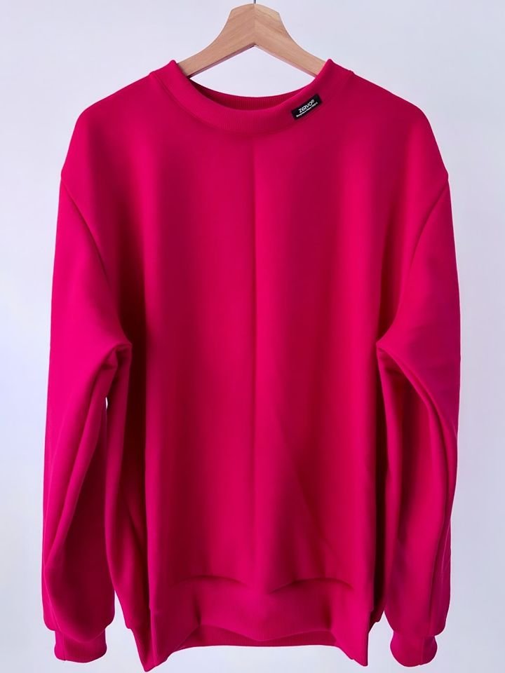 Buzo fucsia ZERVO en percha